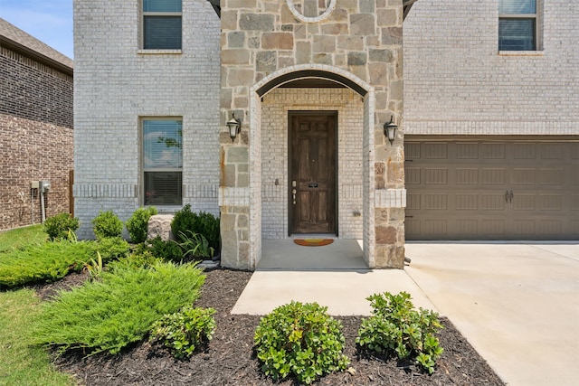 view of exterior entry featuring a garage