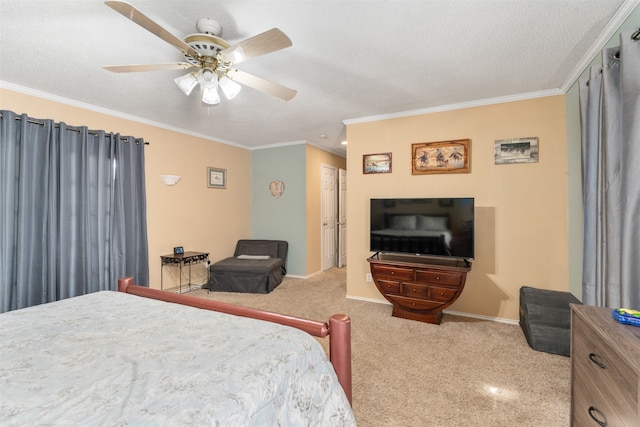 bedroom featuring a closet, ceiling fan, ornamental molding, carpet floors, and a textured ceiling