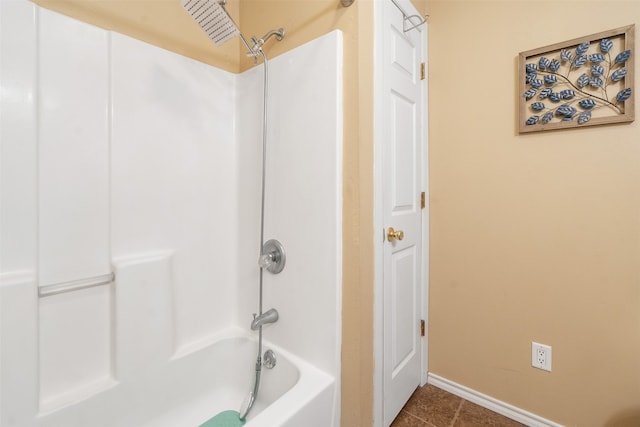 bathroom with tile patterned floors and shower / tub combination