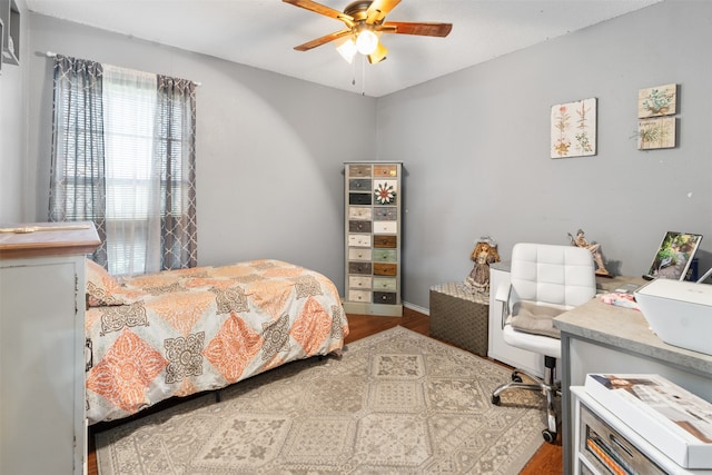 bedroom featuring hardwood / wood-style floors and ceiling fan