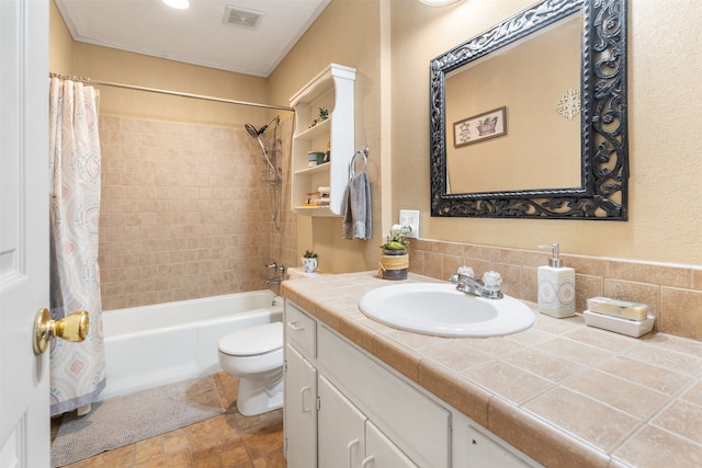 full bathroom with tasteful backsplash, tile patterned flooring, toilet, shower / tub combo with curtain, and vanity