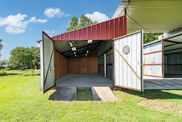 exterior space with a yard and an outbuilding