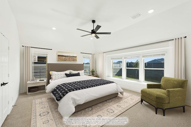 carpeted bedroom featuring ceiling fan and vaulted ceiling