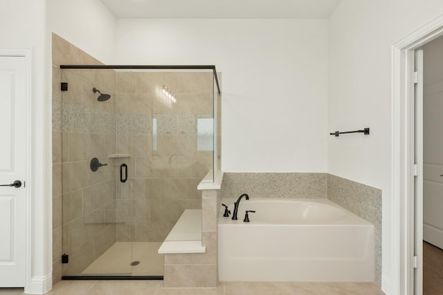 bathroom featuring separate shower and tub and tile patterned flooring