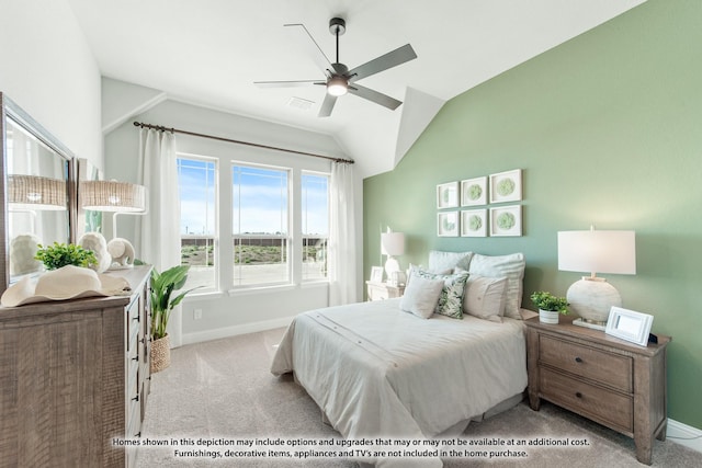 carpeted bedroom featuring ceiling fan and vaulted ceiling