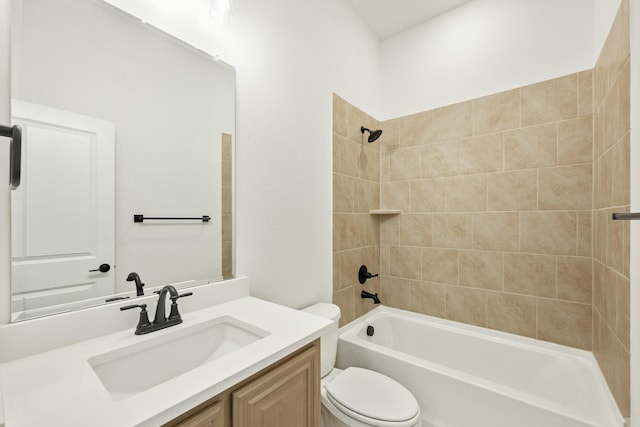 full bathroom with vanity, toilet, and tiled shower / bath