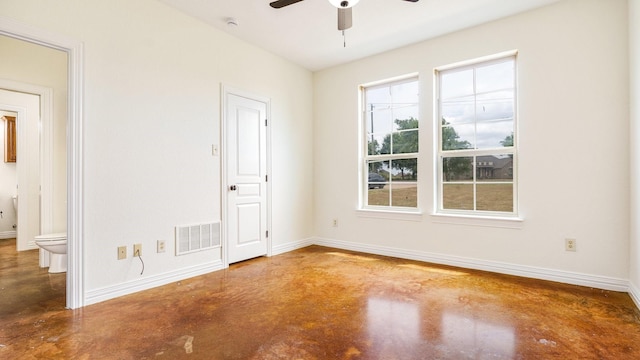 unfurnished room featuring concrete flooring and ceiling fan