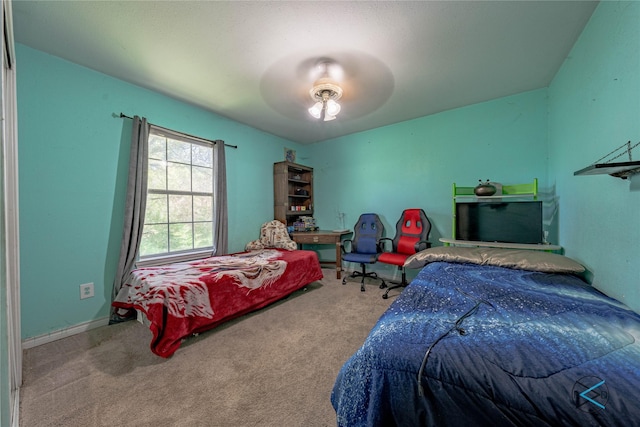 bedroom featuring ceiling fan and carpet flooring