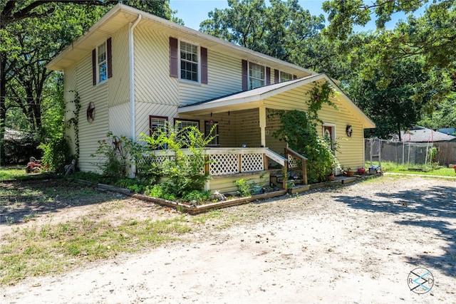 view of front property featuring covered porch