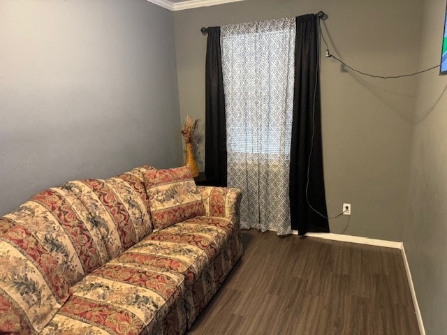 living room with ornamental molding and dark hardwood / wood-style floors