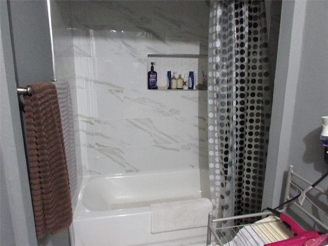 bathroom with shower / bathtub combination with curtain