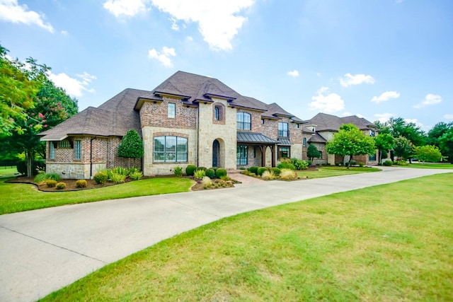 view of front of home with a front lawn