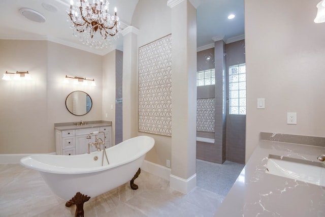 bathroom featuring tile patterned flooring, a washtub, a chandelier, and vanity