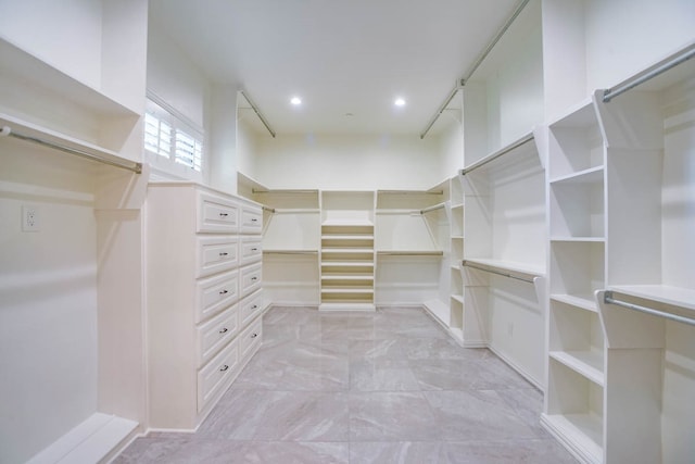 walk in closet featuring light tile patterned flooring