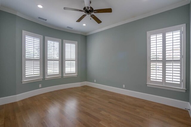 unfurnished room featuring wood-type flooring, ceiling fan, and crown molding