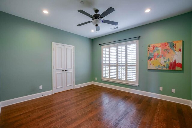 spare room featuring ceiling fan and hardwood / wood-style floors