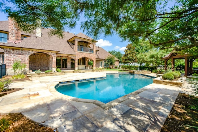 view of pool featuring a patio area