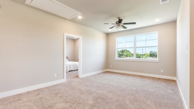 spare room featuring carpet and ceiling fan