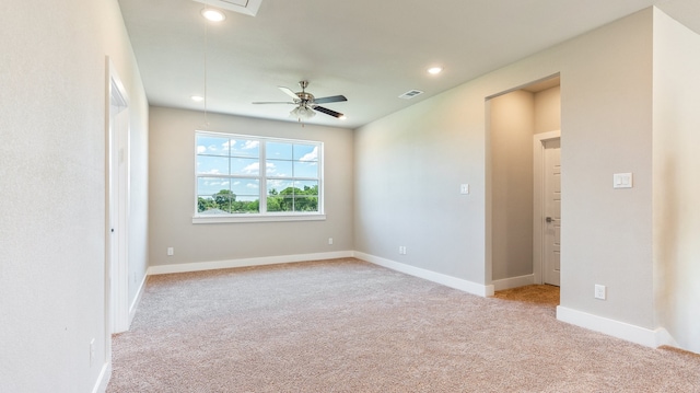 empty room with light carpet and ceiling fan