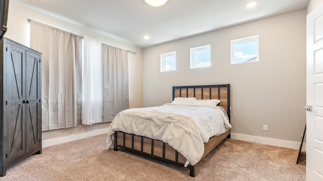 bedroom featuring light colored carpet