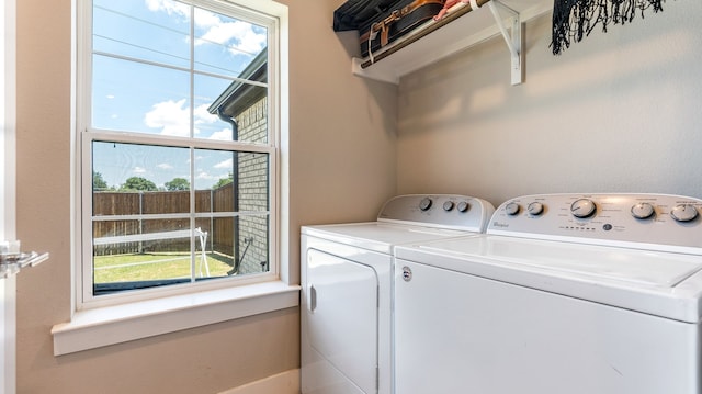 clothes washing area featuring washing machine and dryer