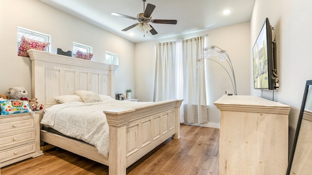 bedroom featuring light wood-type flooring and ceiling fan