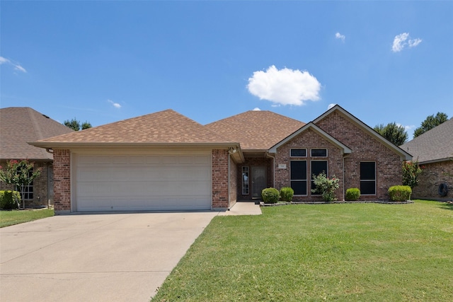 ranch-style home featuring a garage and a front lawn