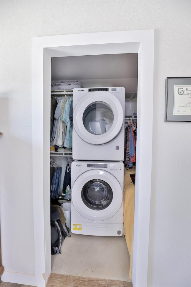 laundry room with laundry area and stacked washing maching and dryer