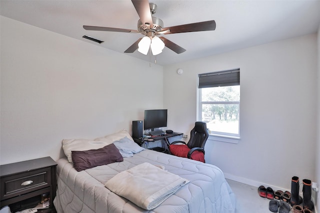 bedroom featuring a ceiling fan and baseboards