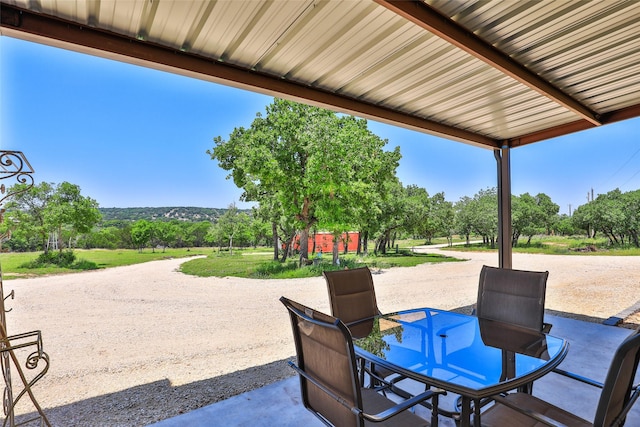 view of patio featuring outdoor dining area