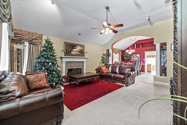 living room with a textured ceiling, carpet flooring, lofted ceiling, and ceiling fan