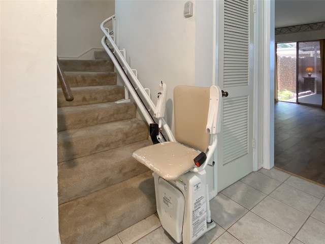 staircase with light hardwood / wood-style floors