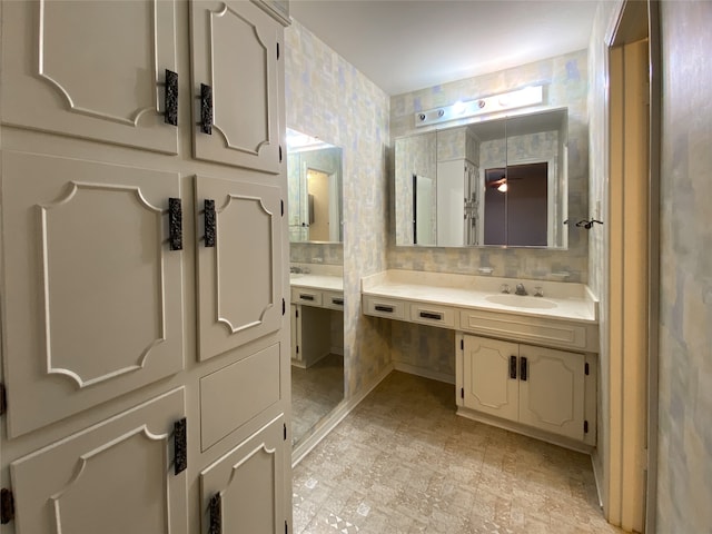 bathroom featuring tile patterned floors, tasteful backsplash, and vanity