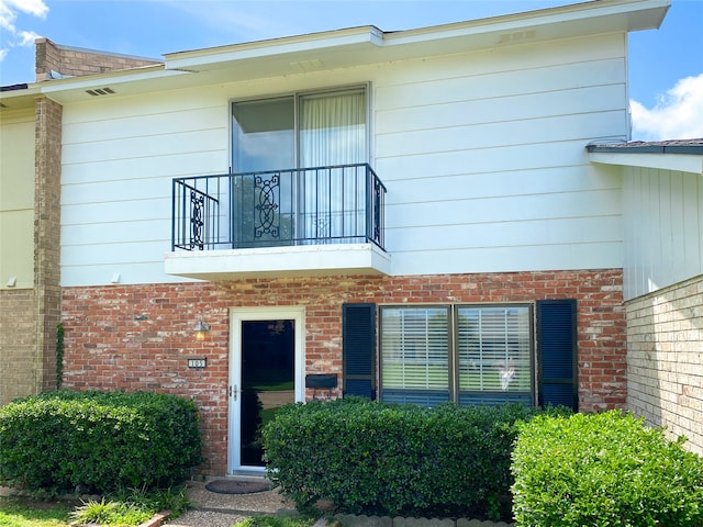 view of front of home with a balcony