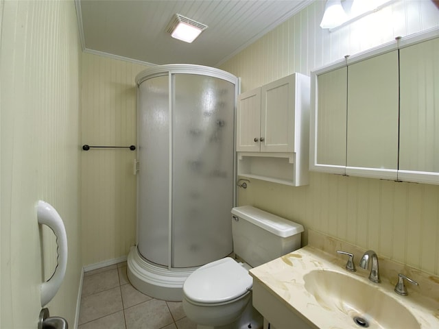 full bath with tile patterned flooring, toilet, vanity, a stall shower, and crown molding