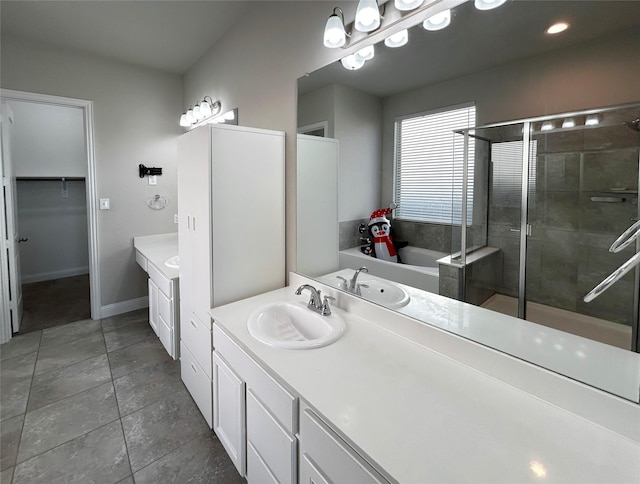 bathroom with tile patterned flooring, shower with separate bathtub, and vanity