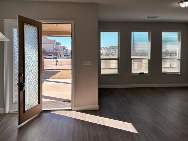 recreation room with hardwood / wood-style flooring and a healthy amount of sunlight