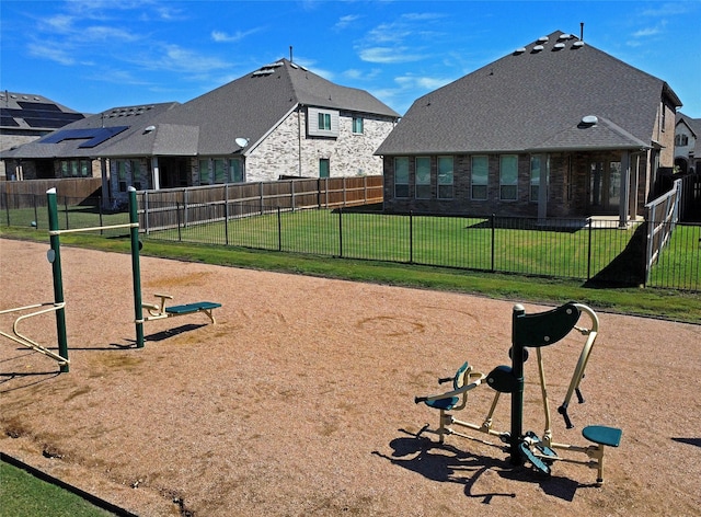 view of property's community featuring a yard