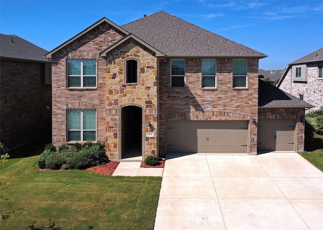 view of front of house featuring a garage and a front lawn