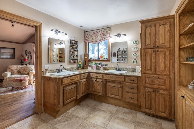 bathroom featuring vanity, hardwood / wood-style flooring, and ornamental molding