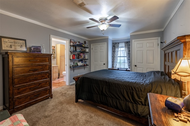 carpeted bedroom with a textured ceiling, crown molding, ensuite bath, and ceiling fan