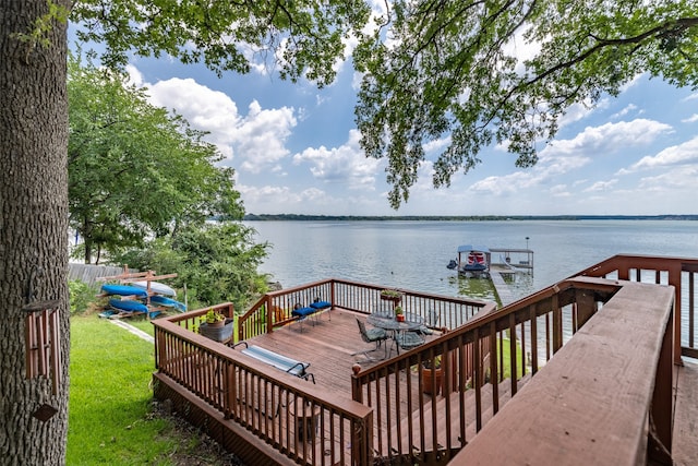 dock area with a deck with water view