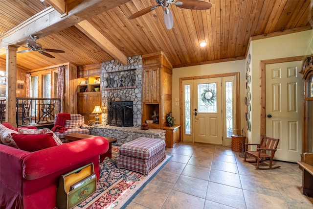 living room with wood ceiling, ceiling fan, beam ceiling, and a fireplace