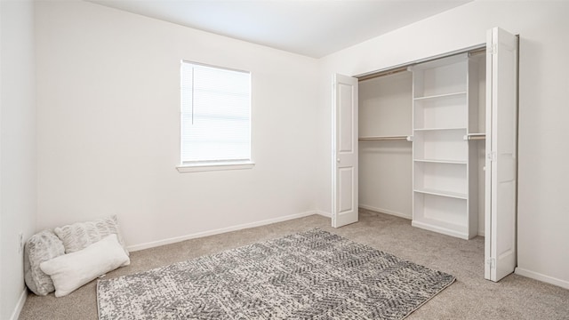 carpeted bedroom with a closet