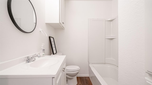 full bathroom with vanity, wood-type flooring, bathing tub / shower combination, and toilet