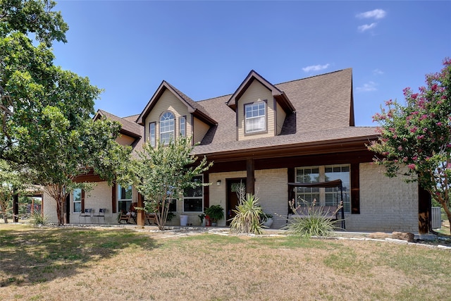 view of front facade with a patio and a front yard