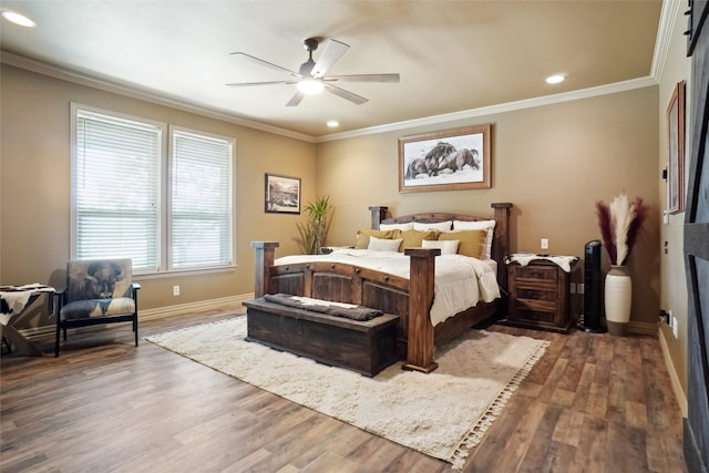 bedroom featuring ceiling fan, crown molding, and dark wood-type flooring