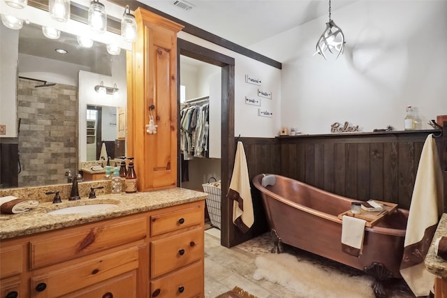 bathroom with vanity and tile patterned flooring