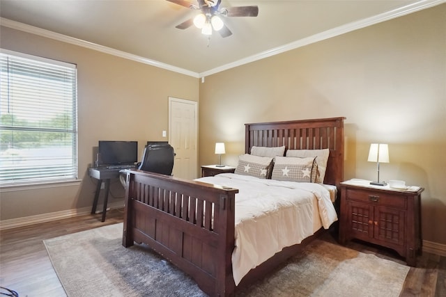 bedroom featuring ceiling fan, crown molding, and dark hardwood / wood-style flooring