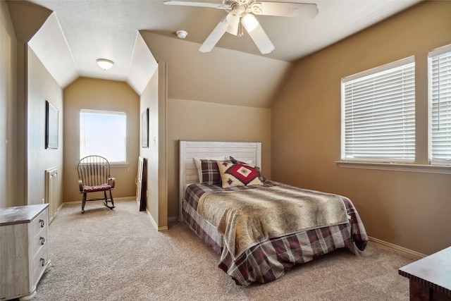 carpeted bedroom with lofted ceiling and ceiling fan